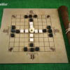 Tablut-Stoff-mit-Verzierungen-und-Spielsteinen-aus-Marmor.